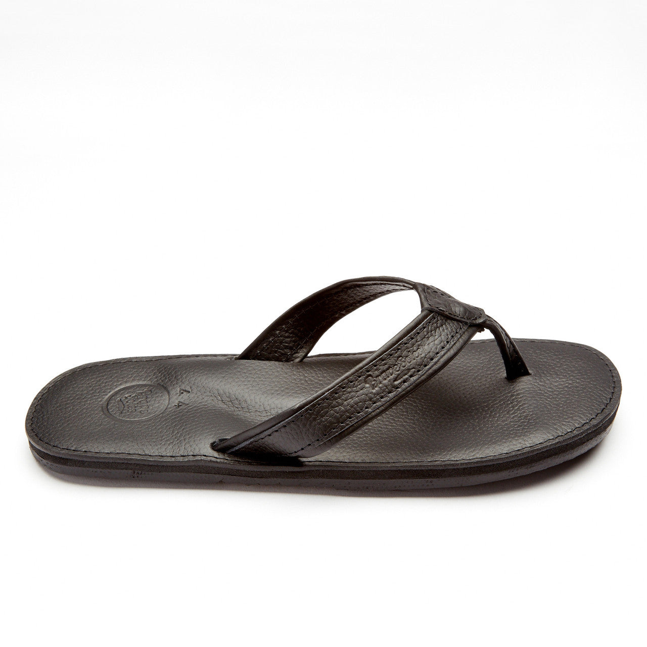 The Padre men's black leather flip flop with cushioned sole and handmade tire tread outsole