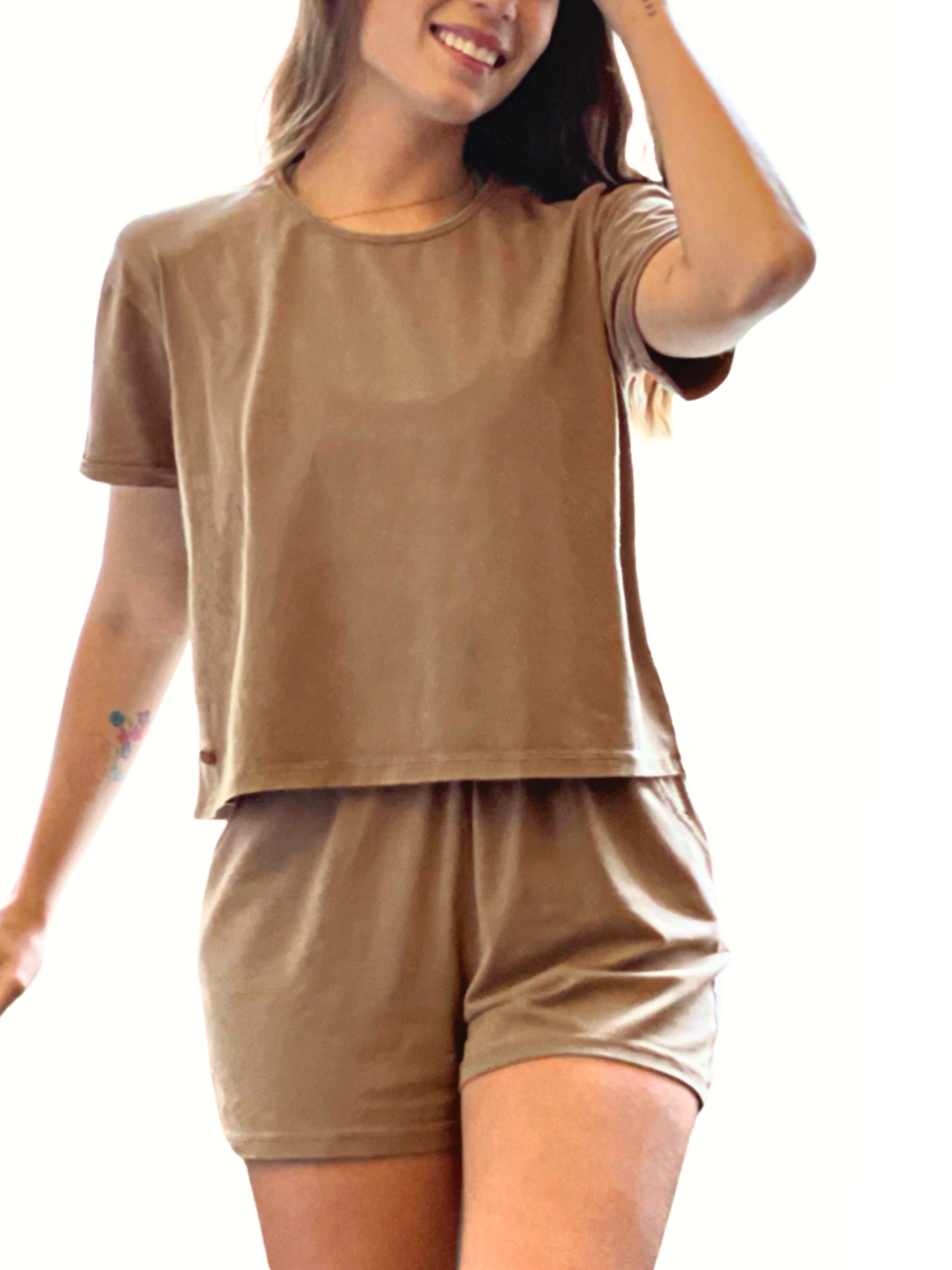 Woman wearing Creamfields Organic Cotton beige soft short and matching top pajamas set