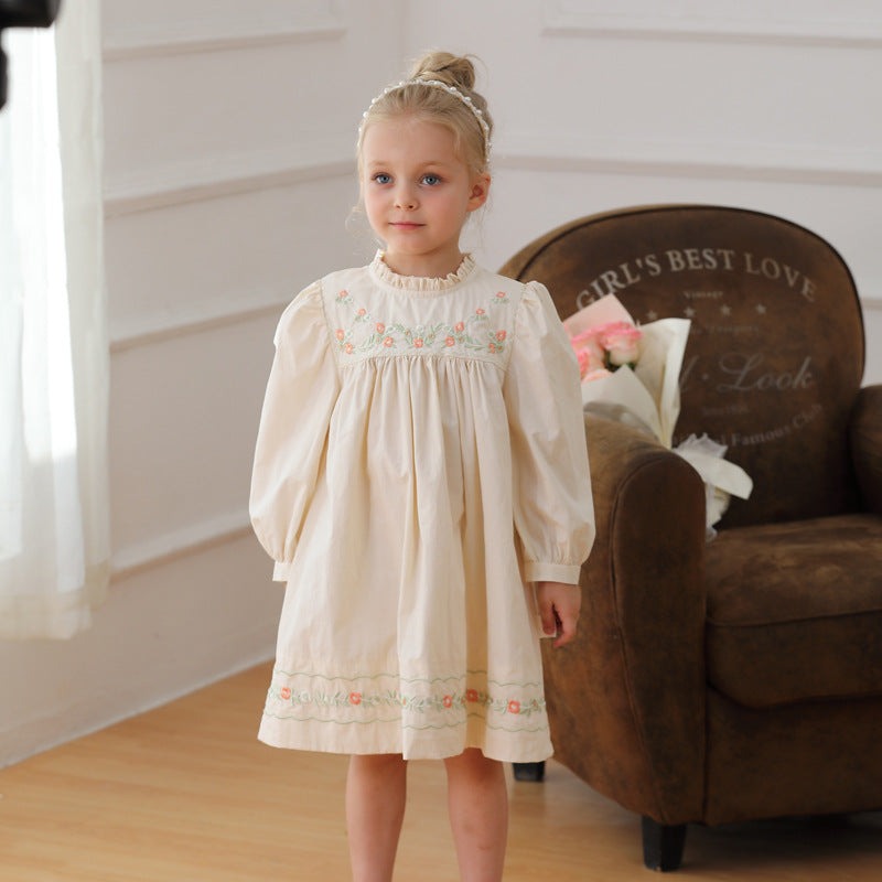 Baby girl wearing apricot cotton embroidered long sleeve dress with ruffle neck, perfect for autumn and spring seasons