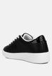 Black faux leather starry glitter star detail chunky flatform sneakers with white rubber sole and lace-up closure