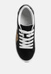 Black chunky flatform sneakers with white laces and glitter gold star detail on side