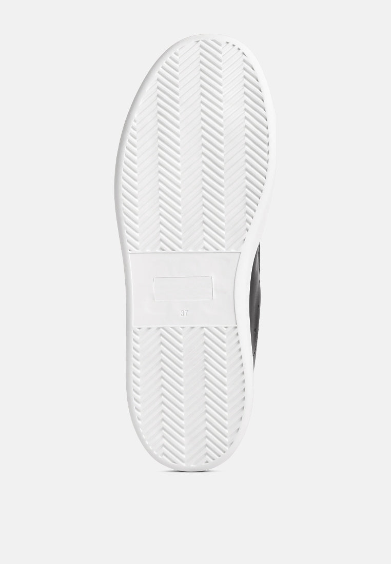 Sole view of white chunky flatform sneakers with rubber outsole and starry glitter detail